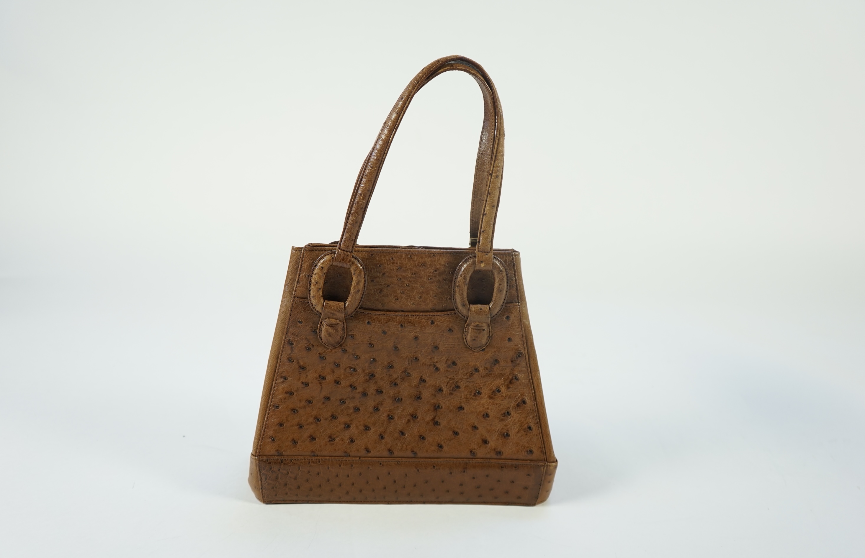 Three handbags, including Tilasse Alviero Martini canvas and leather tote, a monogram Coach tote with dust bag and a Kristar Croco brown ostrich effect leather shoulder bag